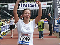 Claire crosses the finish line in the Derby 10k
