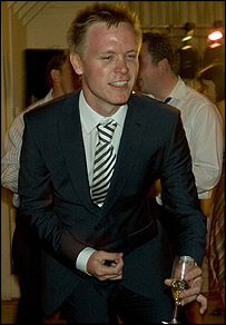 Graeme McLoughlin plays air guitar