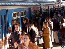 Passengers getting on and off a train