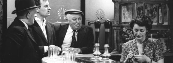 Some people drinking in a pub