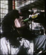 woman drinking a bottle of beer