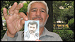 A supporter holds up a photo of President Ahmadinejad
