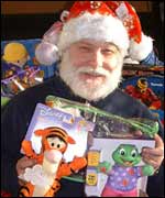 One of the volunteers handing out toy appeal gifts 