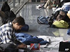 A stranded passenger uses a PC at New Tokyo International Airport