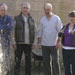 Workman, Daniel, Malcolm, Jimmy and Scarlett by a burst water pipe.