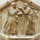 Relief sculpture of Plato and Aristotle debating animatedly