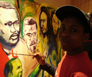 Boy helping to create the 'Freedom' frieze