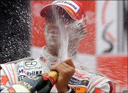 Lewis Hamilton celebrates with champagne