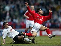 Adam Bolder tackles David Friio