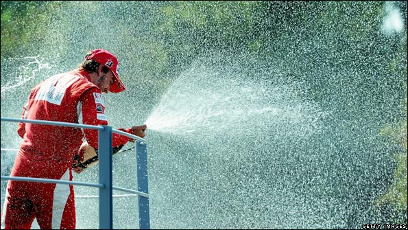 Fernando Alonso celebrates victory at Monza