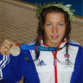Paralympic swimmer Nyree Lewis holding her silver medal