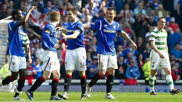 Andrew Little (centre) is congratulated by his Rangers team-mates after scoring his team's second goal at Ibrox. Photo: SNS