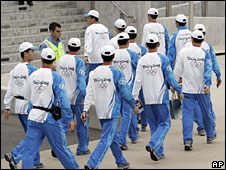 China's torch guardians, the 'men in blue'