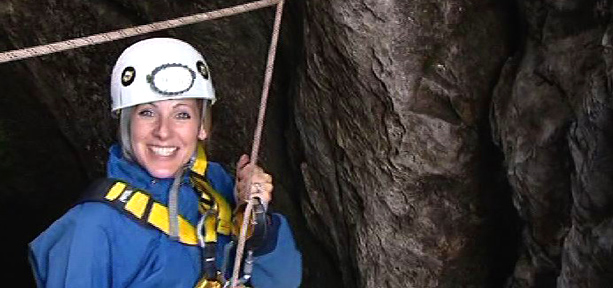 Naomi Wilkinson descending into a cave
