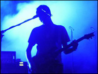 A man holding a guitar