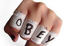 A bandage saying 'obey'