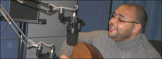 Hany playing and singing in the Learning English studio