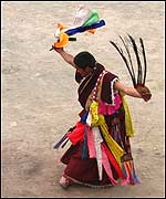 A Monk dancing with human scalps