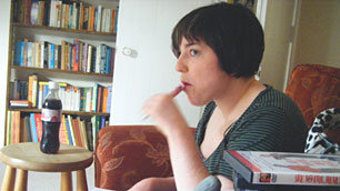 Nicola looking very thoughtful, chewing on her pen as she continues the Disability Movie Marathon
