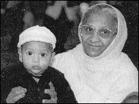 Elderly Muslim with baby