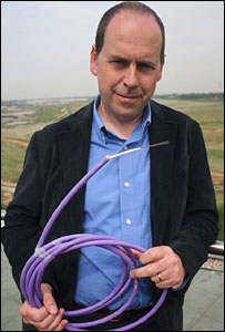 Rory Cellan-Jones holding a fibre-optic cable