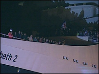 Passengers wave goodbye