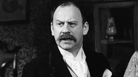 Black and white image of Emrys James, pictured in a 1973 production of George Bernard Shaw's Pygmalion