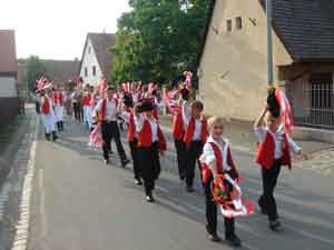 Children parade through the street