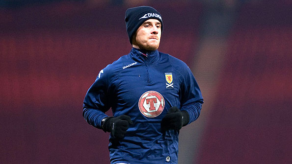 Former Scotland captain Barry Ferguson warms up at Hampden