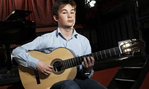 Classical Star: Ian plays the Guitar