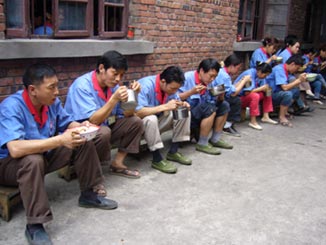 Some factory workers on their lunch break.