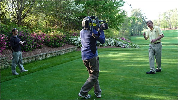 The BBC TV crew film on the 13th tee at Augusta