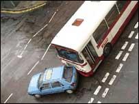car in collision with bus