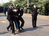 Police arrest a miner at Orgreave coking works in 1984.