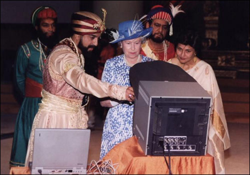 Queen Elizabeth II during tour in India visits a film studio and views some rushes