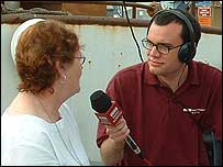 Presenter Chris Goreham interviews a guest.
