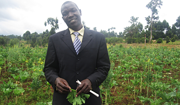 Naboth Okadie, Headteacher at Bishop Okiring, in the school vegetable garden