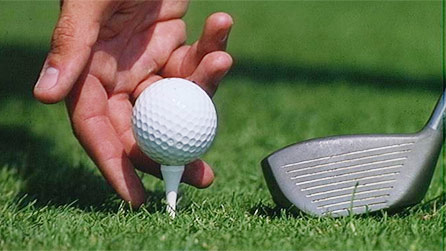 A golfer about to tee-off