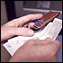 Finance Information (image: man putting money in a wallet