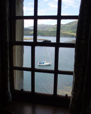 View of yacht in water from a castle window