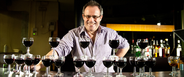 Mike Parr with a stockpile of wine showing his weekly intake