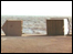 Beach huts are blown over by the 1987 Great Storm