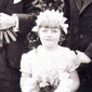 A sweet-pea wedding, with auntie Gladys and uncle Minnis, 1931. A 6 year old Margaret is in the centre wearing new white buckskin shoes