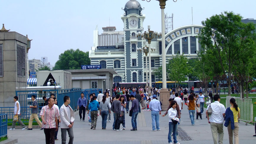 Busy city square with clock - Beijing.
