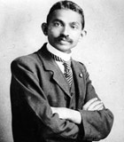 Gandhi as a young man in a suit and tie
