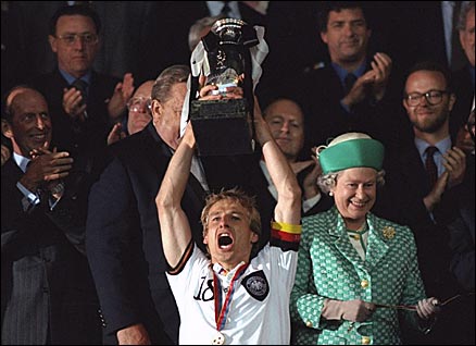 German captain Jurgen Klinsmann receives the European Championsihp trophy from the Queen at Wembley, 1996