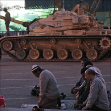 Protesters at evening prayer near tanks in Egypt