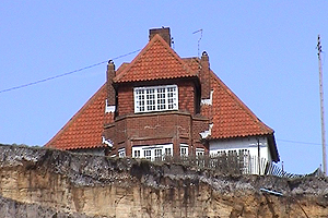 APeter Boggis from Southwold in Suffolk is trying to stop his house falling over an eroding clifftop.