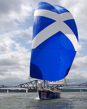 Edinburgh Inspiring Capital flying a Saltire spinnaker on the River Forth