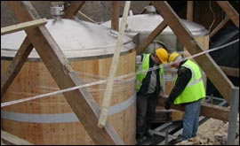 Workers installing the fermentation vessels